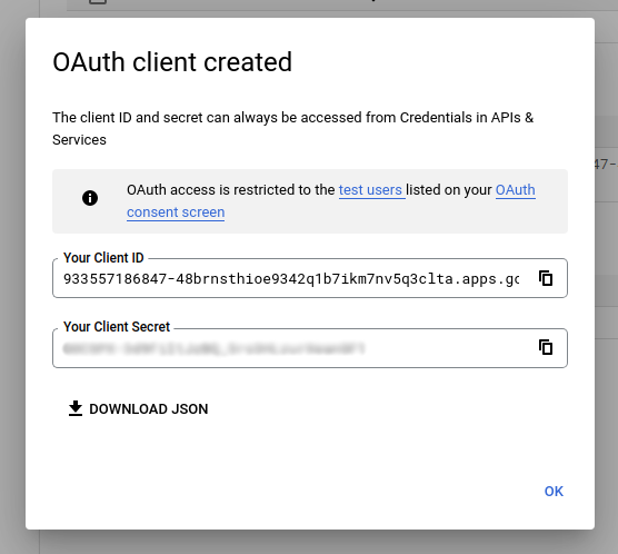 The modal displaying the generated OAuth client ID and client secret